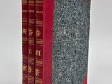two books sitting on top of each other on a white surface