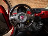 a steering wheel and dashboard of a small car