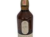 a bottle of whisky with a white label on it