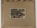 photograph of a black and white photo of a horse and a man with a dog