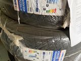 a stack of tires that have been wrapped in plastic