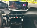 a car dashboard with a radio and a steering wheel