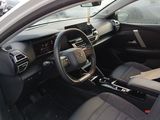 the interior of a car with a steering wheel and dashboard