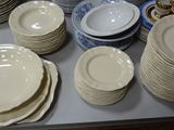 a table with many plates and bowls on it