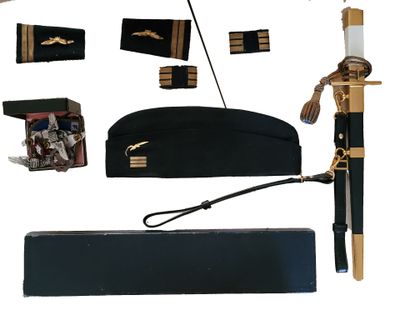 a picture of a collection of military items including a sword, hat, and other items