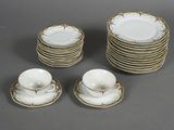 a lot of plates and cups sitting on a table