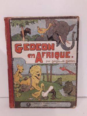 un vieux livre pour enfants avec une illustration représentant un éléphant et d'autres animaux