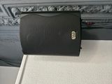 a black purse sitting on top of a white table