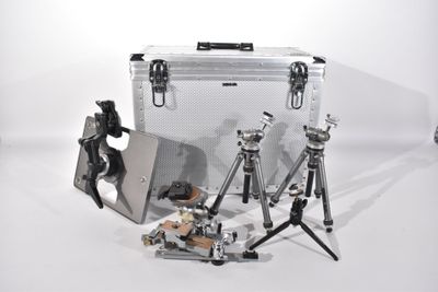 a silver case with a laptop and a tripod on it