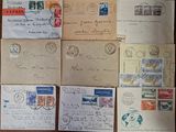 several old envelopes are sitting on a table with stamps on them
