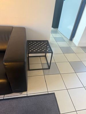 a couch and a table in the corner of a room