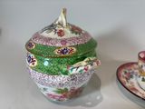 a small bowl and saucer sitting on a table
