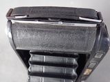 a close up of a watch with a leather strap