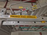 a picture of a metal ladder with a yellow sticker on it