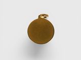 a close up of a gold pendant on a white background