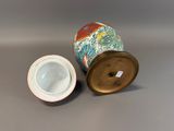 an image of a vase with a lid on a table