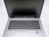 an open laptop computer sitting on top of a white table