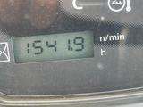 a close up of a digital clock on a car ' s dashboard