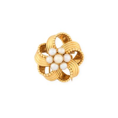 a close up of a gold ring with pearls on a white background