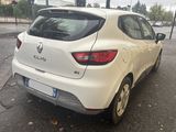 a white car that is parked on the side of the street