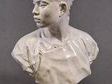 a close up of a bust of a woman on a pedestal