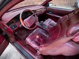 a red car with a red leather interior and red leather seats