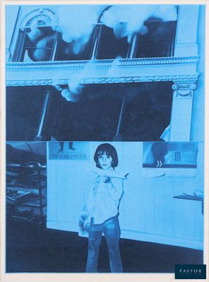 blue and white photograph of a woman standing in front of a building