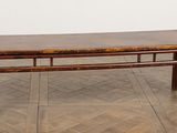 an image of a wooden bench on a parquet floor