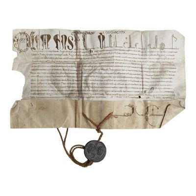 un gros plan d'une feuille de papier portant un cachet de cire
