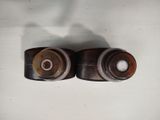 two different types of wood and metal knobs on a white surface