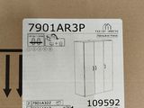 packaging for a refrigerator in a cardboard box with a sticker on it