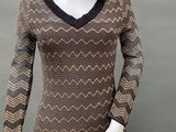 an image of a mannequin mannequin wearing a brown and black dress