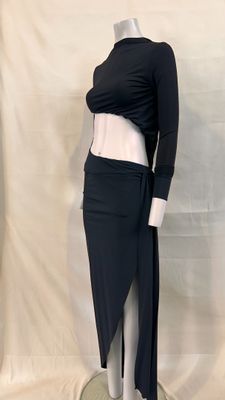a mannequin with a black top and skirt on a mannequin stand