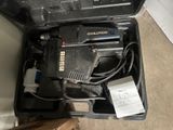 a tool in the case that is sitting on the floor