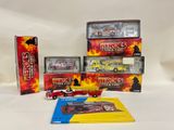 a few boxes of toys that include a fire truck, firetruck, and a firetruck