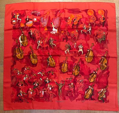 an image of a red scarf with musical instruments on it