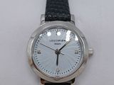 a close up of a wrist watch on a person ' s arm