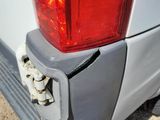 a close up of the rear end of a white van