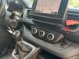 a car dashboard with a steering control and a gps device