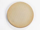 an overhead view of a wooden plate on a white surface