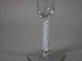 a wine glass that is sitting on a table