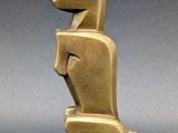 an image of a bronze sculpture of a dog on a pedestal