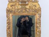 a man taking a picture of himself in a mirror