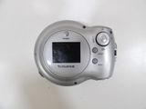 a silver camera that is sitting on a table