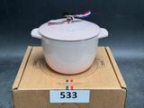 a white pot sitting on top of a cardboard box