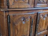a wooden cabinet that is sitting on a hard wood floor