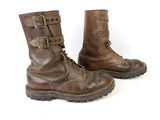 pair of brown leather boots with buckles and buckles on them