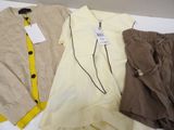 three pieces of clothing sitting on top of a table next to each other