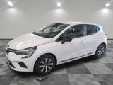 a white car is parked in a room with a checkered floor