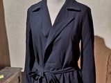 an image of a coat on a mannequin stand